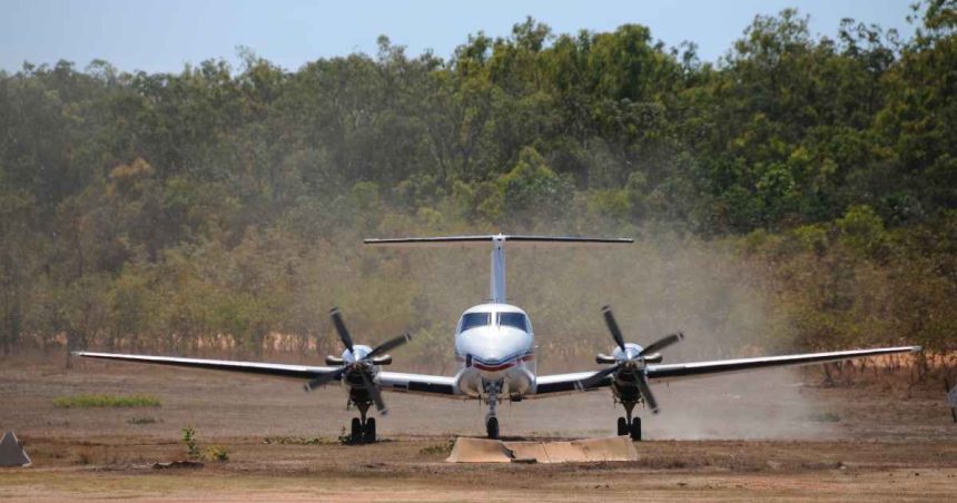 Royal Flying Doctor Service plane touches down on dusty airstrip