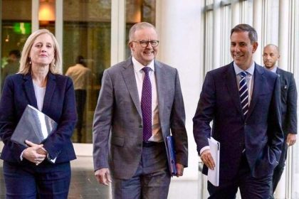 Treasurer Jim Chalmers walks with Prime Minister Anthony Albanese in the halls of Parliament House