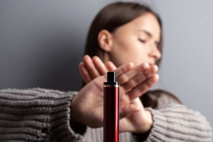 Teenage girl gestures no to an offer of a vape