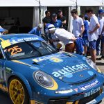 Riverview Inclusion Program students gathering around race car