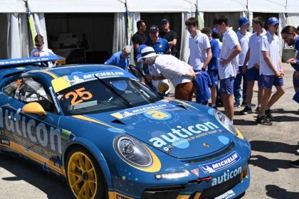 Riverview Inclusion Program students gathering around race car