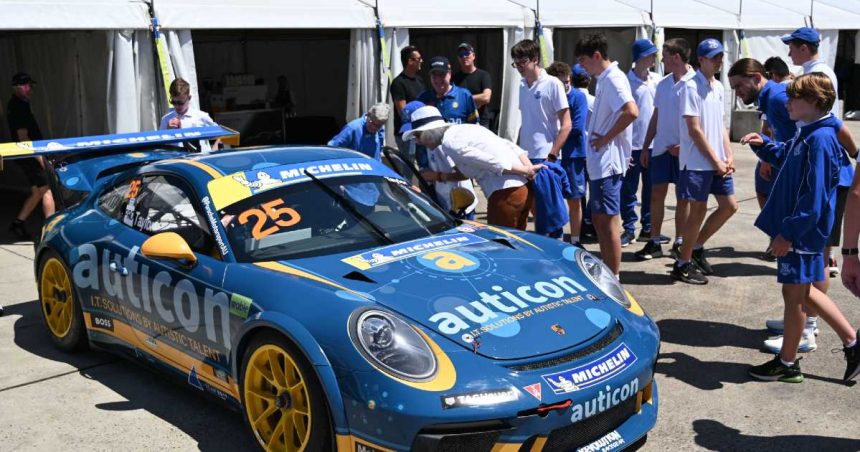 Riverview Inclusion Program students gathering around race car